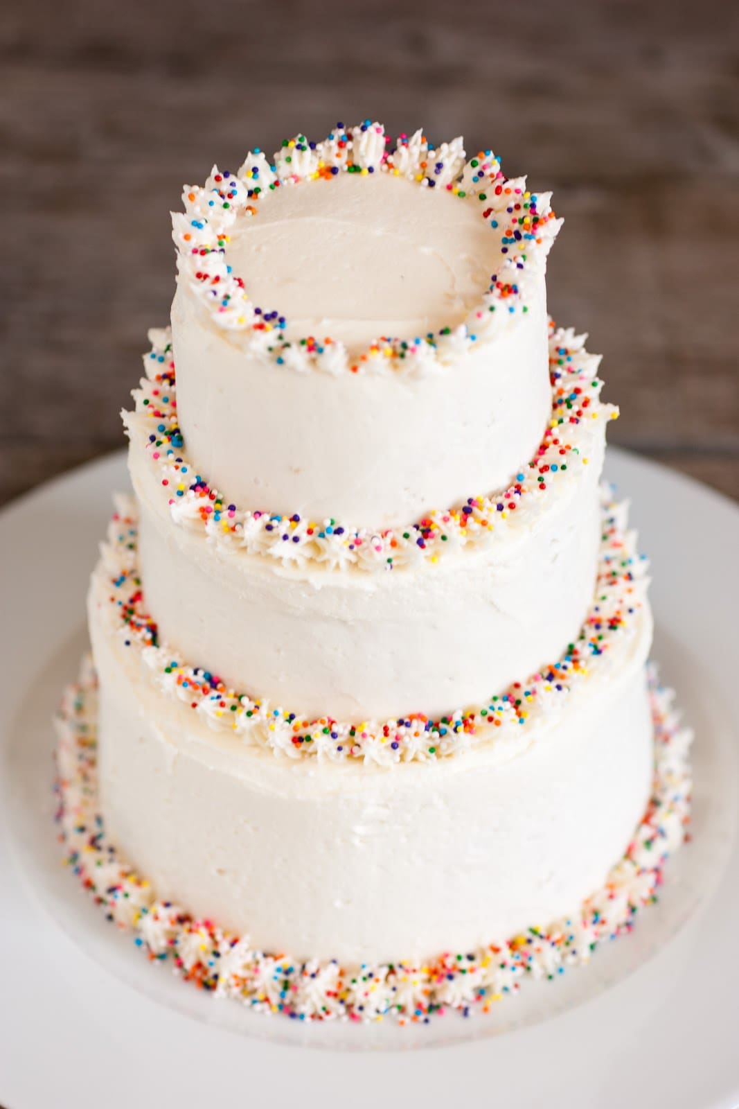 Buttercream Frosting Recipe three tiered cake covered in homemade buttercream frosting