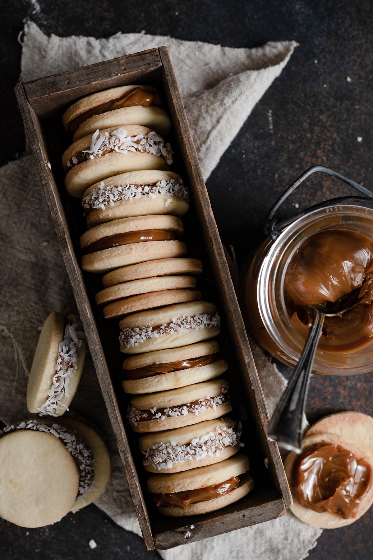 Alfajores Alfajores cookies in a long wooden box.