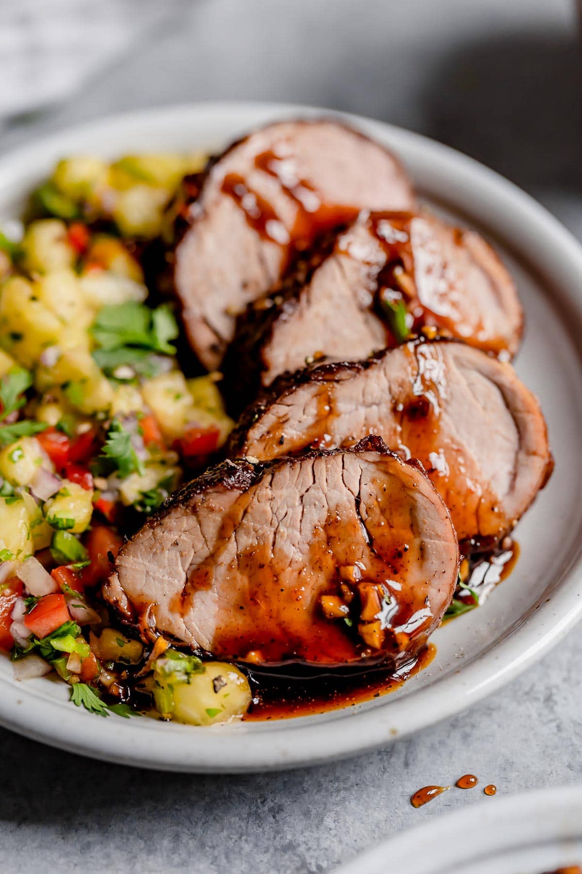 Island Pork Tenderloin Island Pork Tenderloin on a platter with a side of pineapple salsa