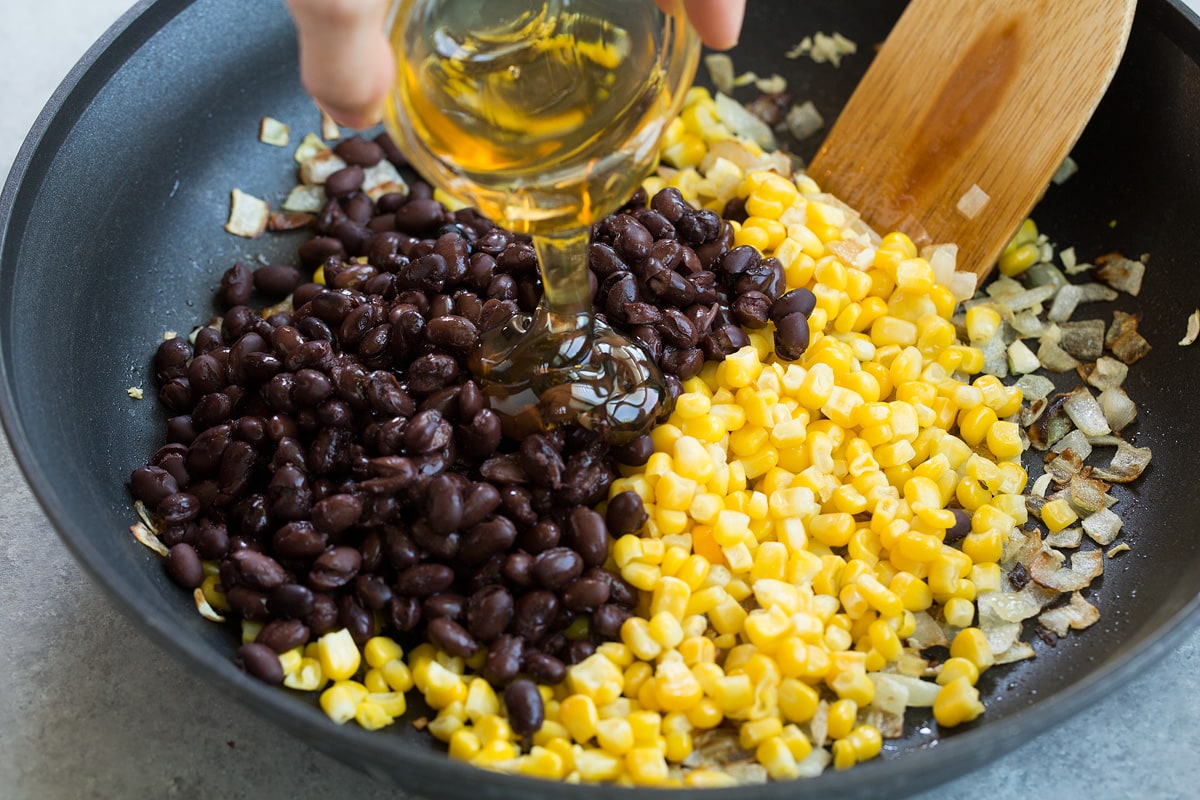 Sweet Potato and Black Bean Tacos Adding black beans, corn, honey and lime to skillet