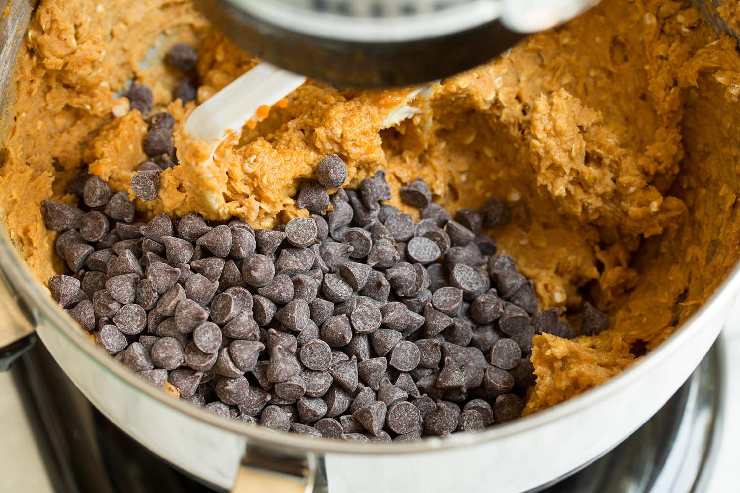 Pumpkin Oatmeal Chocolate Chip Cookies Chocolate chips added to stand mixer with dough.