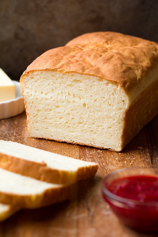 Gluten-Free White Bread | Cooking Classy Gluten-Free Bread loaf on wood cutting board
