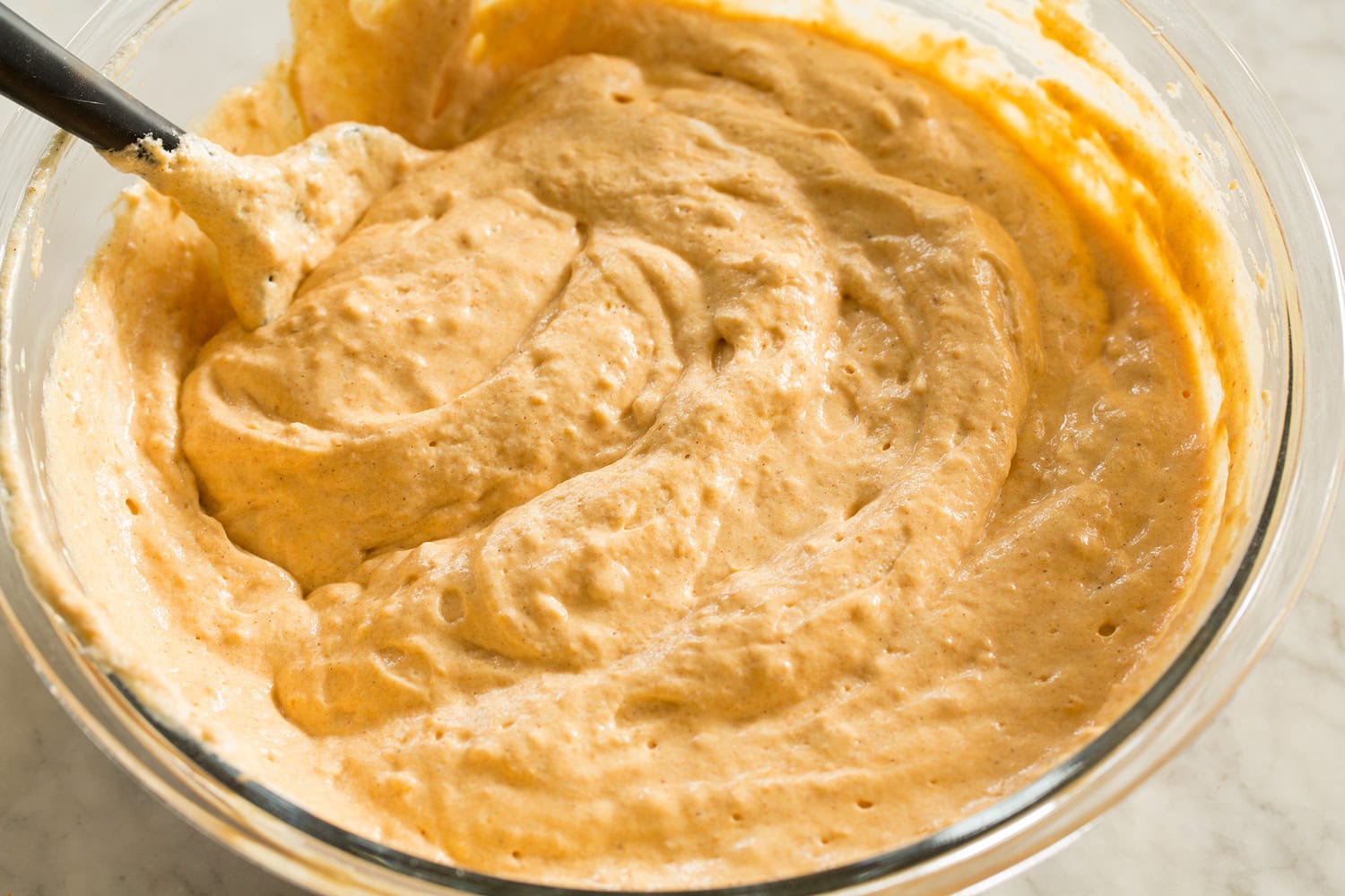Pumpkin Waffles Finished pumpkin waffle batter in a mixing bowl.