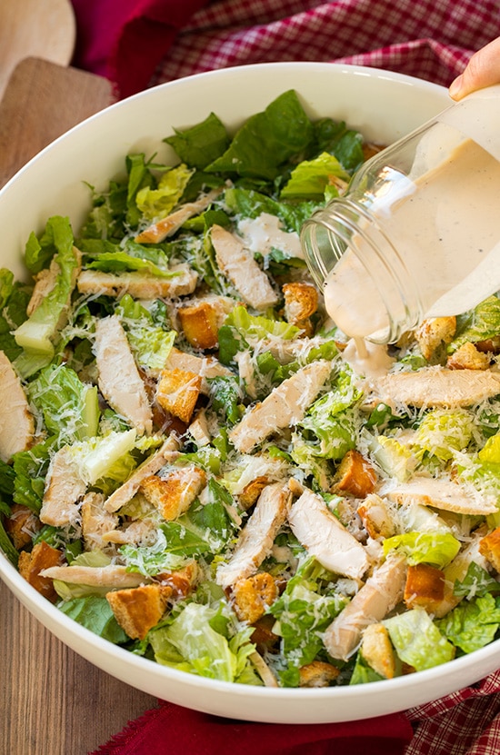 Chicken Caesar Salad with Garlic Croutons and Light Caesar Dressing | Cooking Classy Homemade caesar salad dressing poured on salad