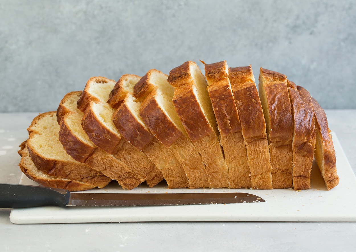 French Toast Cutting brioche bread into slices.