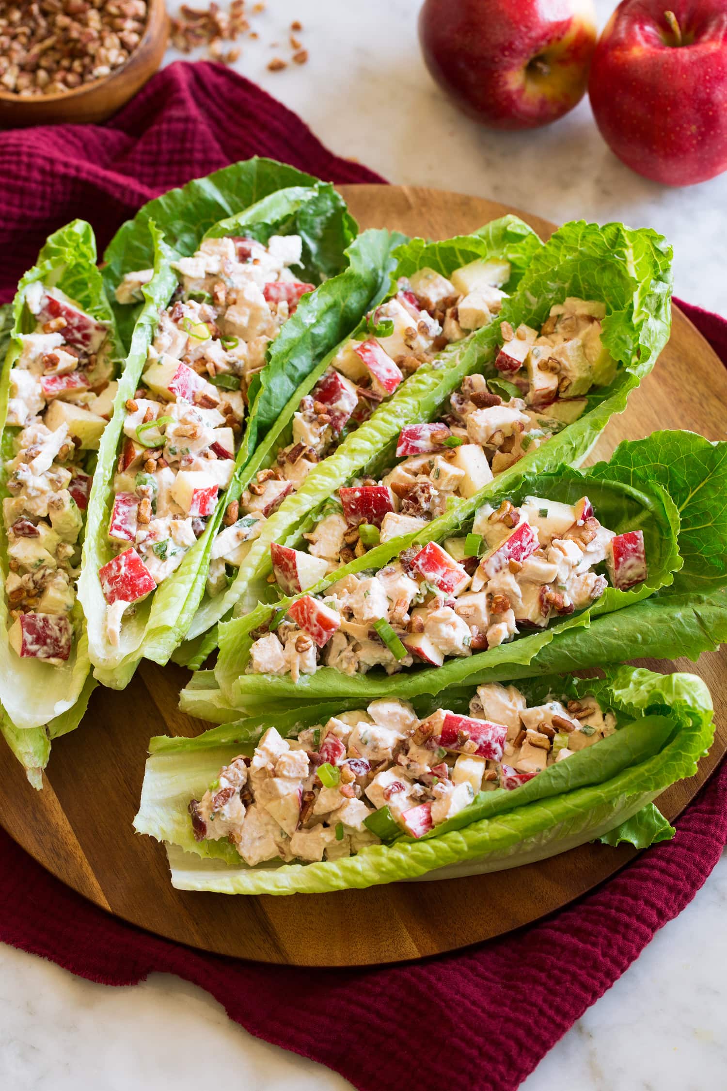 Apple Chicken Salad Apple chicken salad served in lettuce leaf boats.