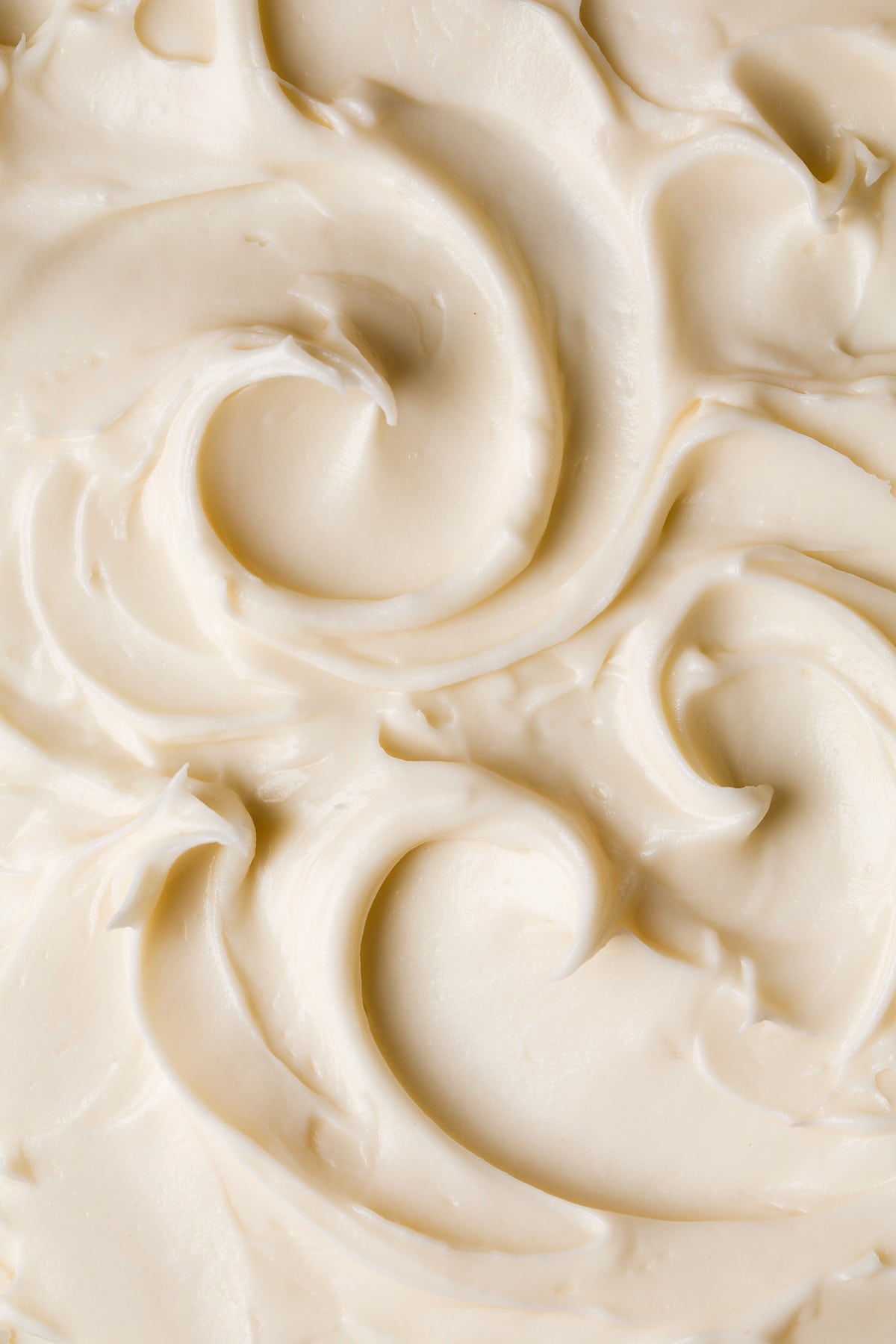 Spice Cake with Cream Cheese Frosting Close up image of cream cheese frosting with pretty swirls.