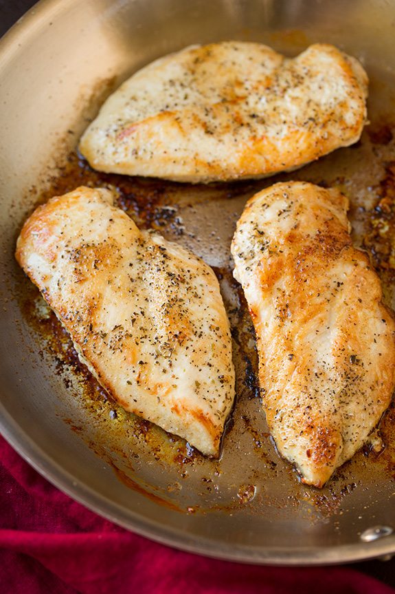 Avocado Caprese Skillet Chicken | Cooking Classy Three browned seasoned chicken breasts shown here in a skillet after cooking