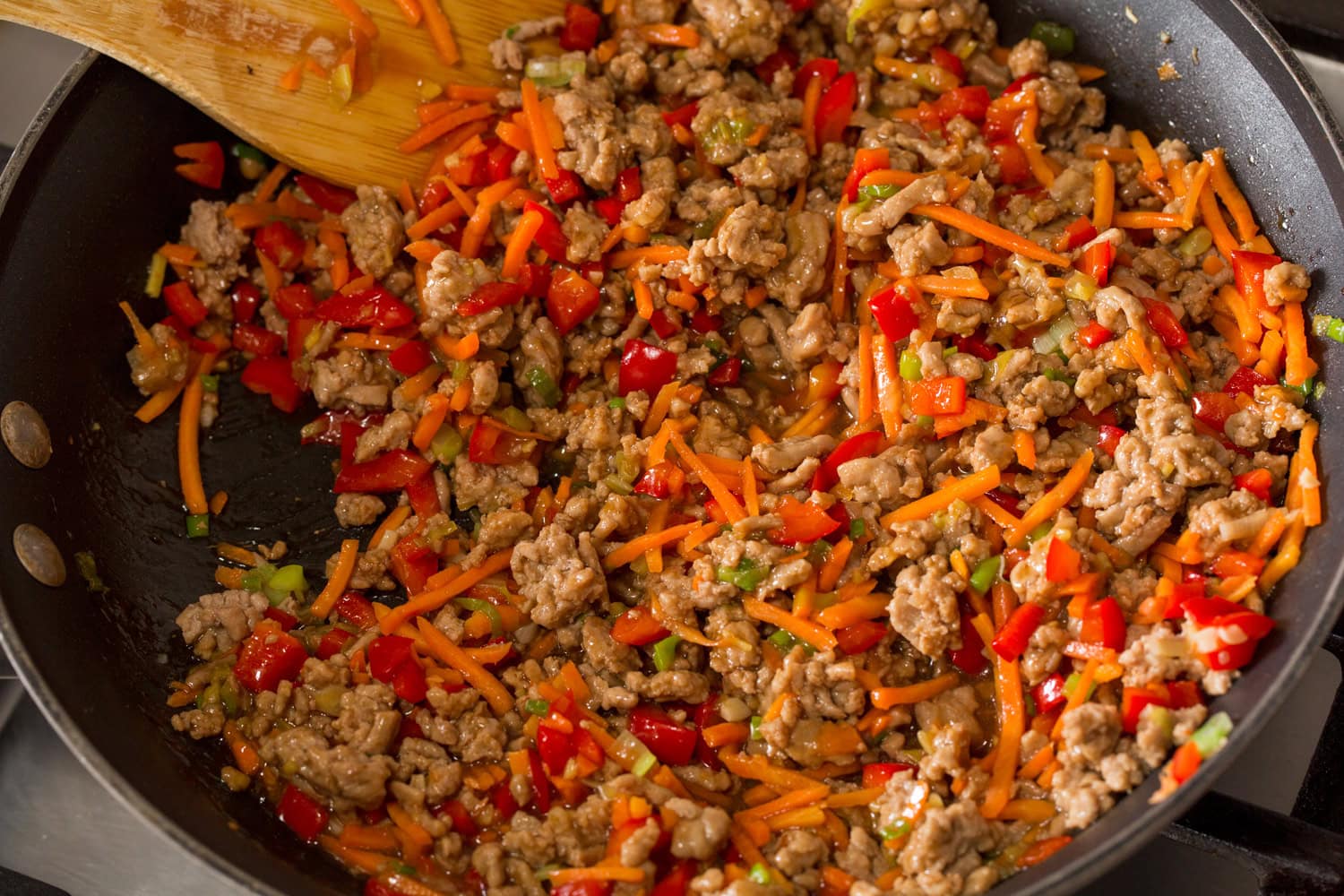 Thai Chicken Lettuce Wraps Completed lettuce wrap filling shown in the skillet.