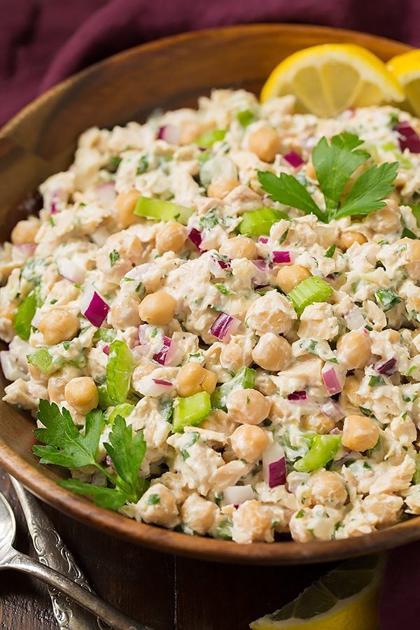 Tuna Chick Pea Pita Pockets Tuna salad in a wooden serving bowl. It includes albacore tune, chick peas, red onion and a creamy lemon herb dressing.