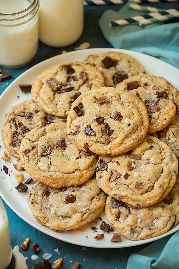 Chocolate Chunk Cookies Chocolate chunk cookies piled onto a white serving plate.
