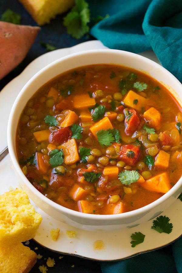 Moroccan Sweet Potato Lentil Soup Sweet potato soup with lentils in a serving white bowl.