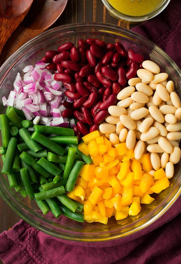 Three Bean Salad Ingredients for three bean salad in a mixing bowl before tossing.