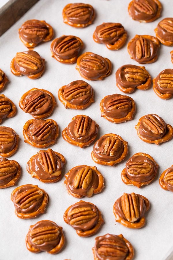 Pretzel Turtles Pretzel Turtles on a baking sheet with parchment paper.