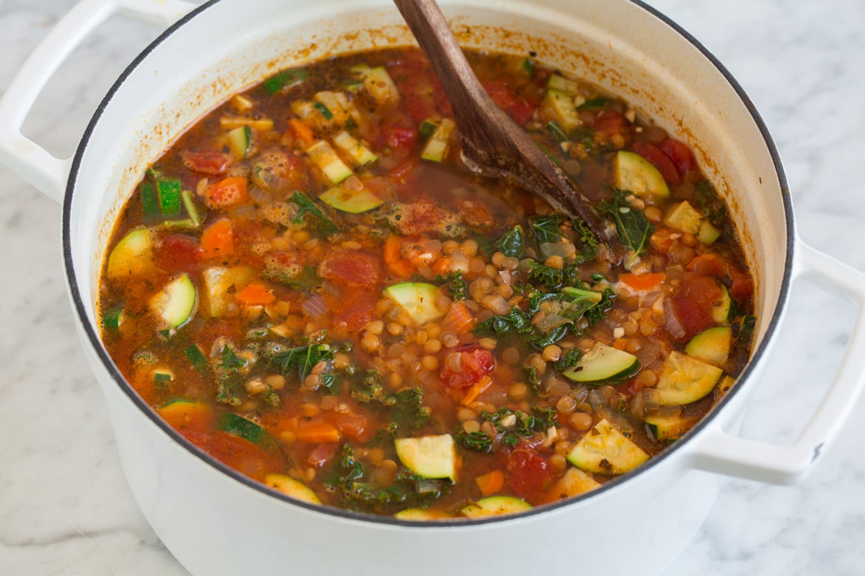 Lentil Soup lentil soup full of vegetables in a large cast iron pot