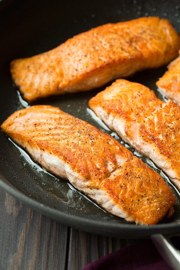 Skillet Seared Salmon with Garlic Lemon Butter Sauce. A delicious and easy meal that's perfect for weeknights. | Salmon Recipes | Fish Recipes | Weeknight Meals | #salmon #fish #cookingclassy Showing how to cook salmon in a pan