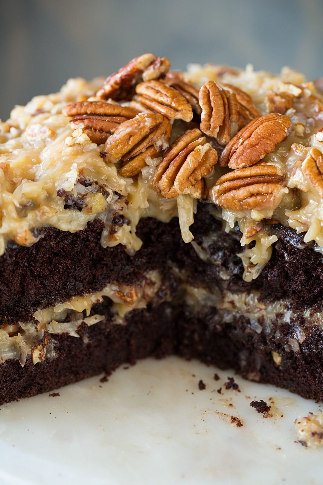 German Chocolate Cake Close up image of German Chocolate Cake showing two chocolate cake layers, and two layers of german chocolate icing made from coconut and pecans.
