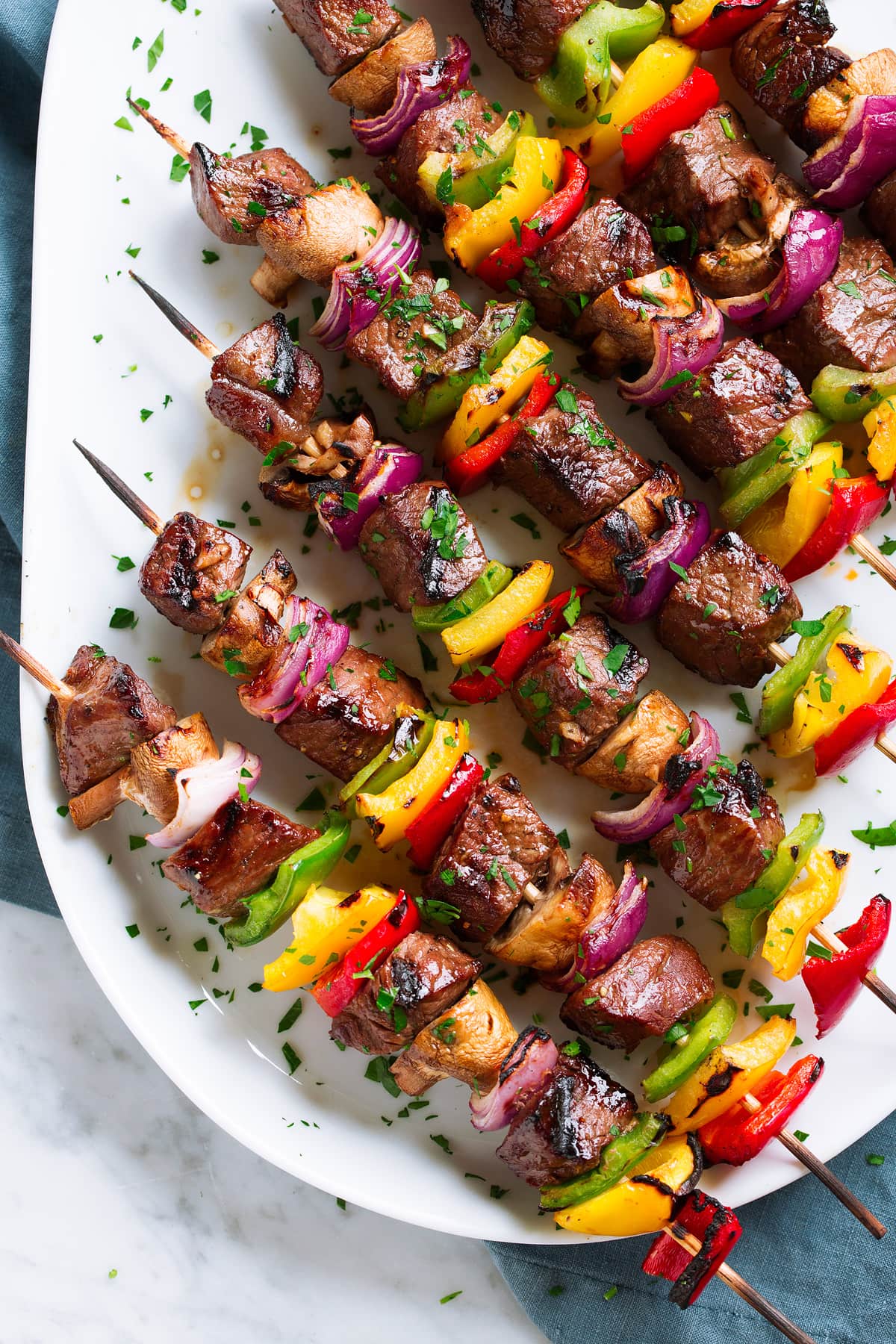Steak Kebabs Grilled Steak Kebabs on an oval white platter.