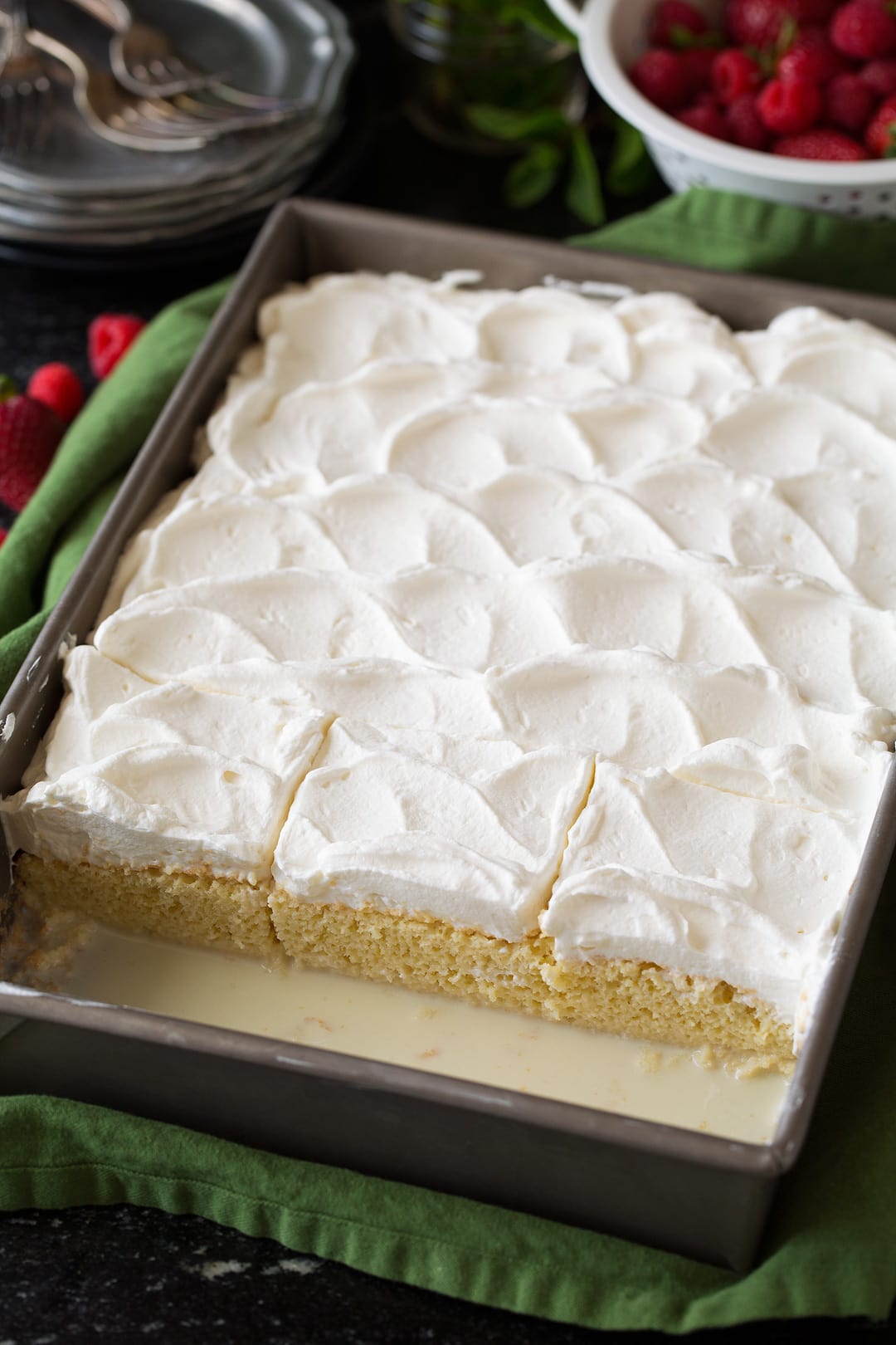 Tres Leches Cake Tres Leches Cake in baking dish, shown after adding whipped cream topping.