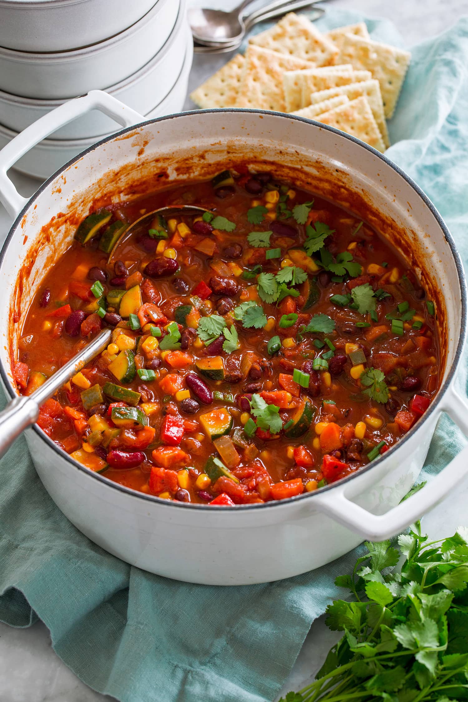 Vegetarian chili in a large white pot. Vegetarian chili in a large white pot.