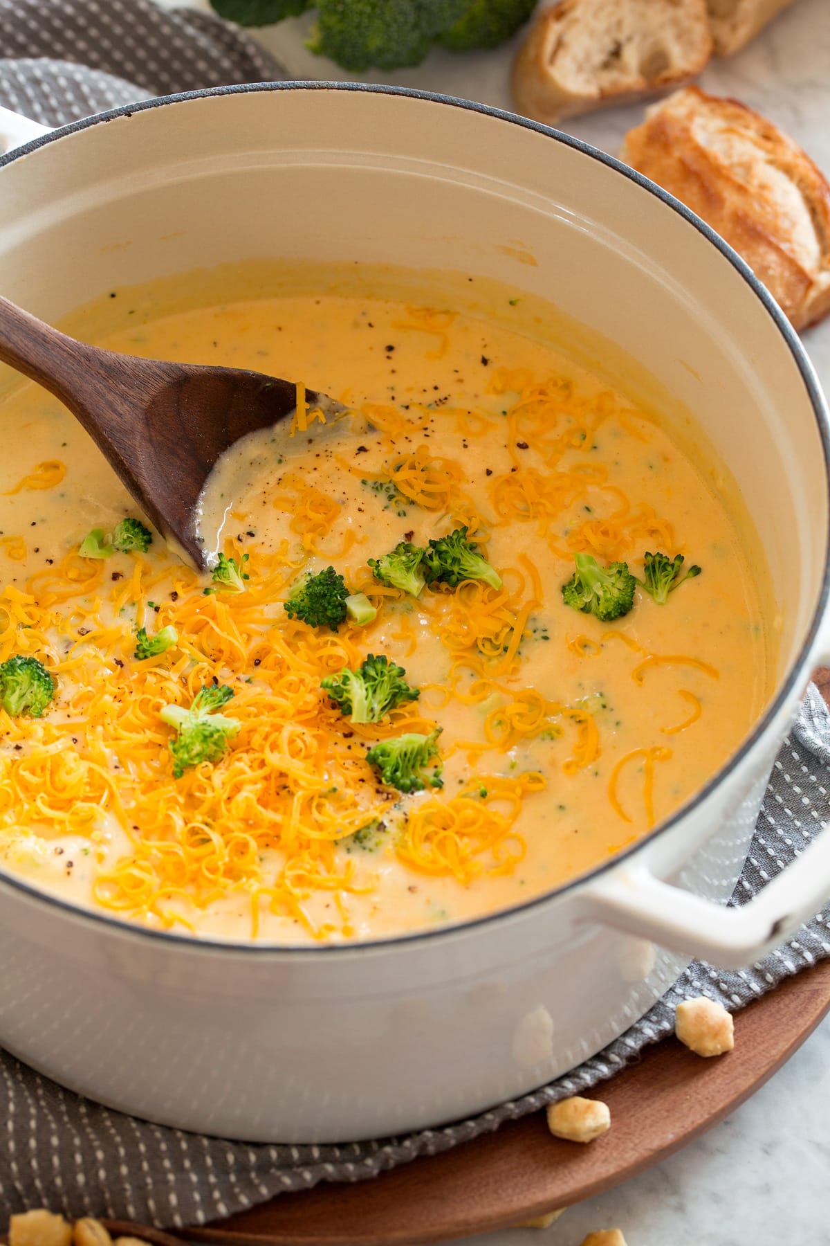 Broccoli Cheese Soup White pot full of broccoli cheese soup.