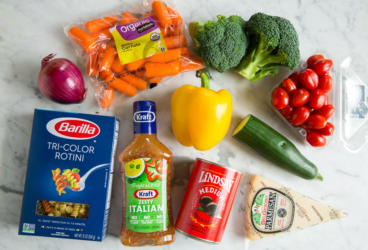 cold salad ingredients on marble countertop
