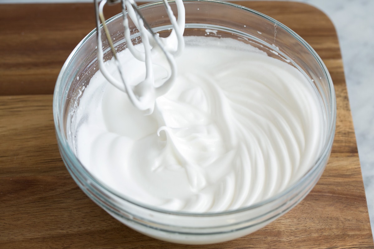 How to Make Perfect Belgian Waffles - with step by step instructions! These are easily the best waffles you'll try! Light and fluffy and tender inside and deliciously crisp outside. #belgian #waffles #breakfast Whipping egg whites in a glass mixing bowl to medium stiff peaks.