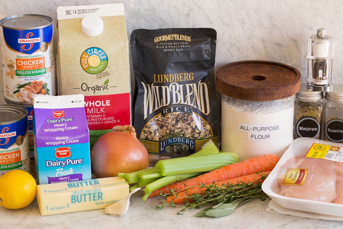 Chicken Wild Rice Soup Image of ingredients used to make chicken and wild rice soup. Includes wild rice, chicken breasts, herbs, carrots, celery, onion, garlic, butter, milk, cream, lemon, flour, salt, pepper and chicken broth.