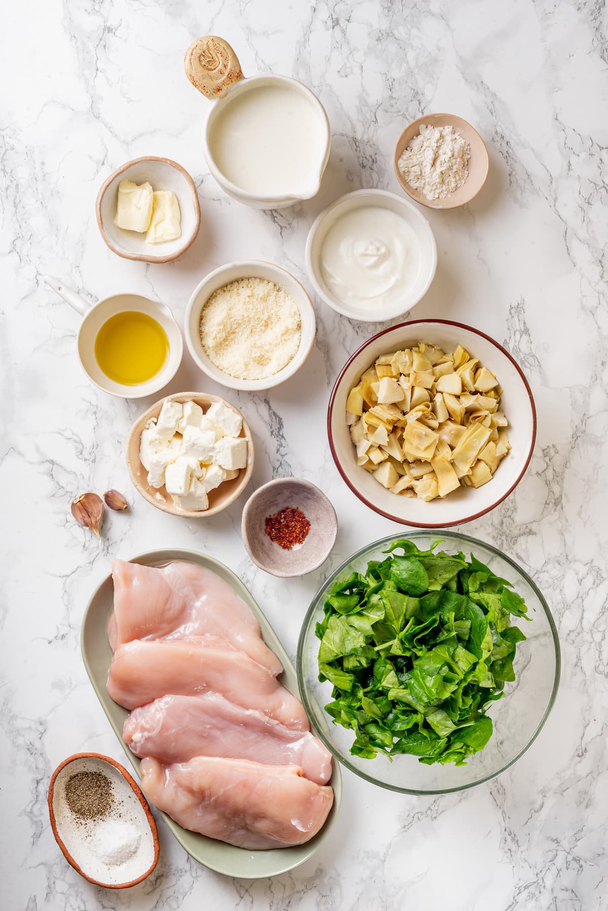 Creamy spinach artichoke chicken is a fast and easy one-pan dinner recipe brimming with briny artichokes, spinach, and lots of melty cheese. Ingredients for spinach artichoke chicken.