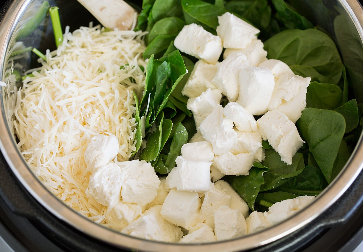 Instant Pot Tuscan Chicken Pasta adding cream cheese parmesan and spinach