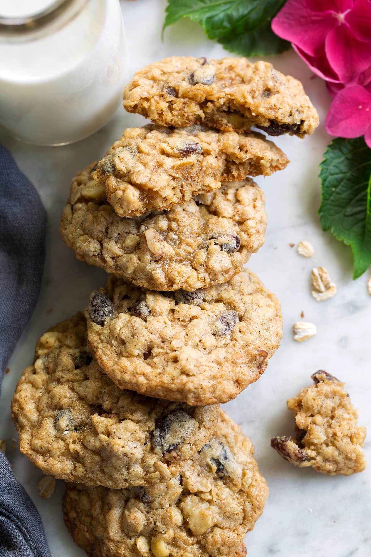 BEST Oatmeal Cookies! Stack of Oatmeal Cookies, one broken to show interior.