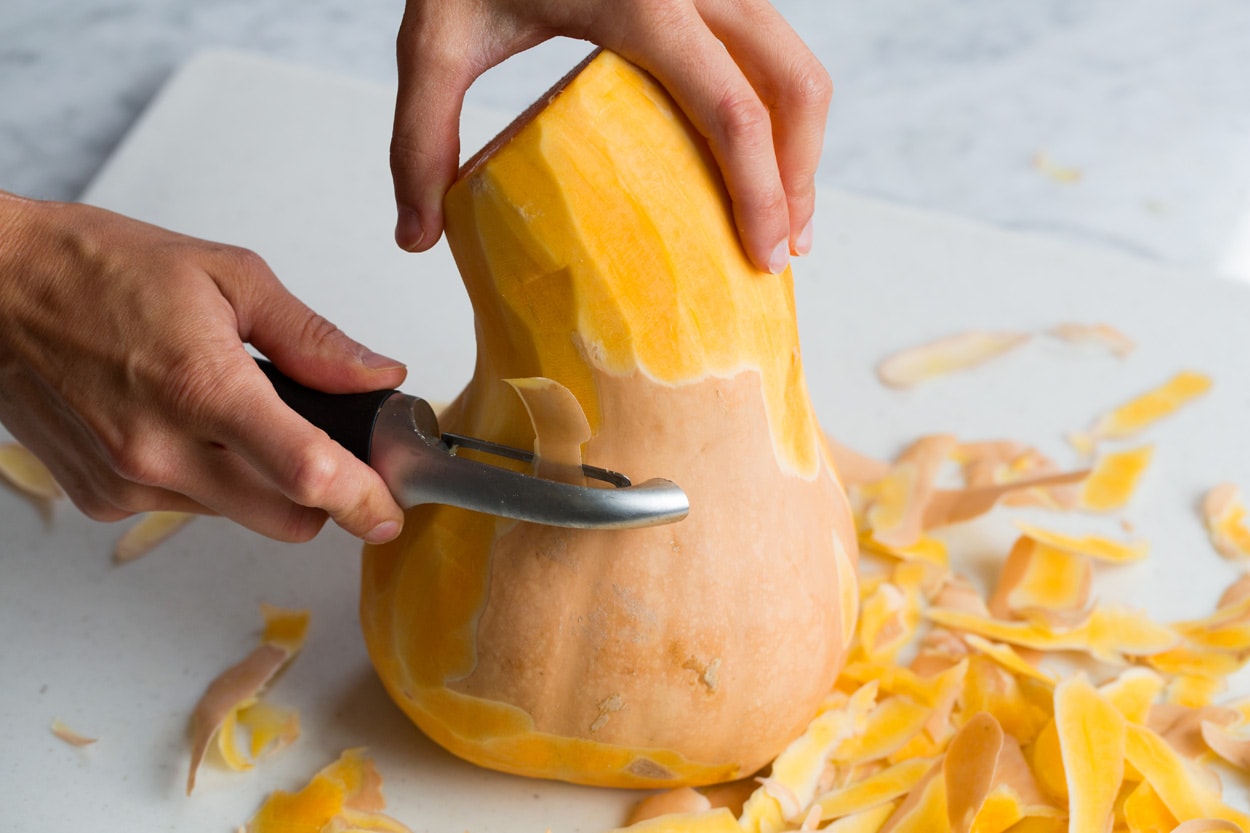 Roasted Butternut Squash with Garlic and Herbs Showing how to peel a butternut squash.