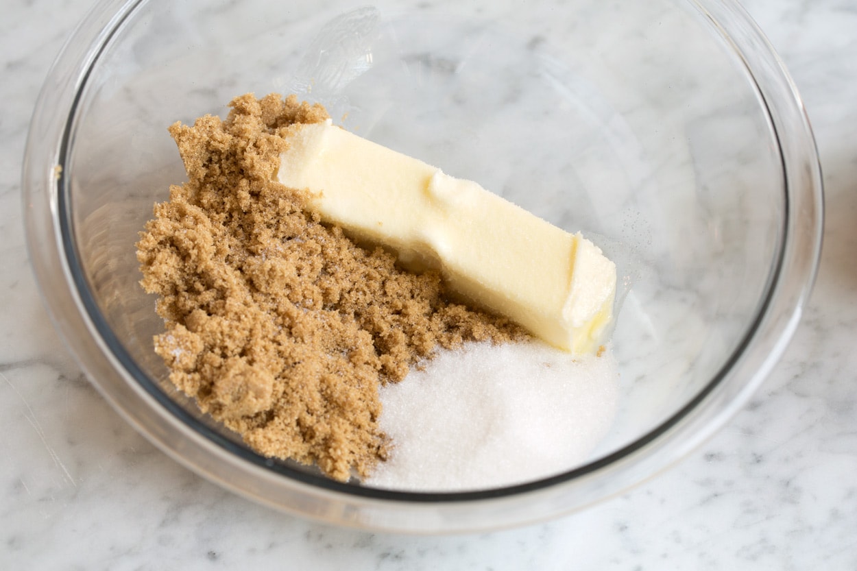 Mixing butter brown sugar and granulated sugar in a mixing bowl for edible cookie dough