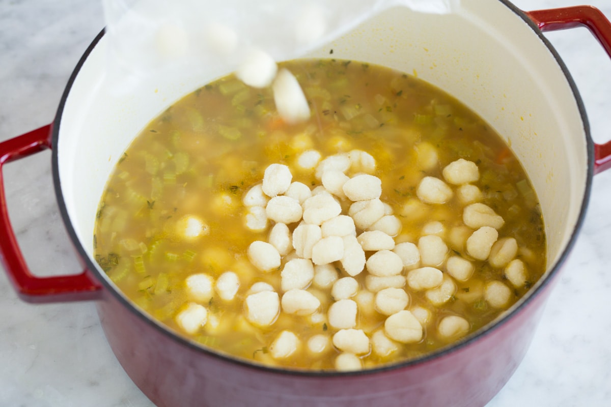 Creamy Chicken Gnocchi Soup Adding mini gnocchi to soup mixture.