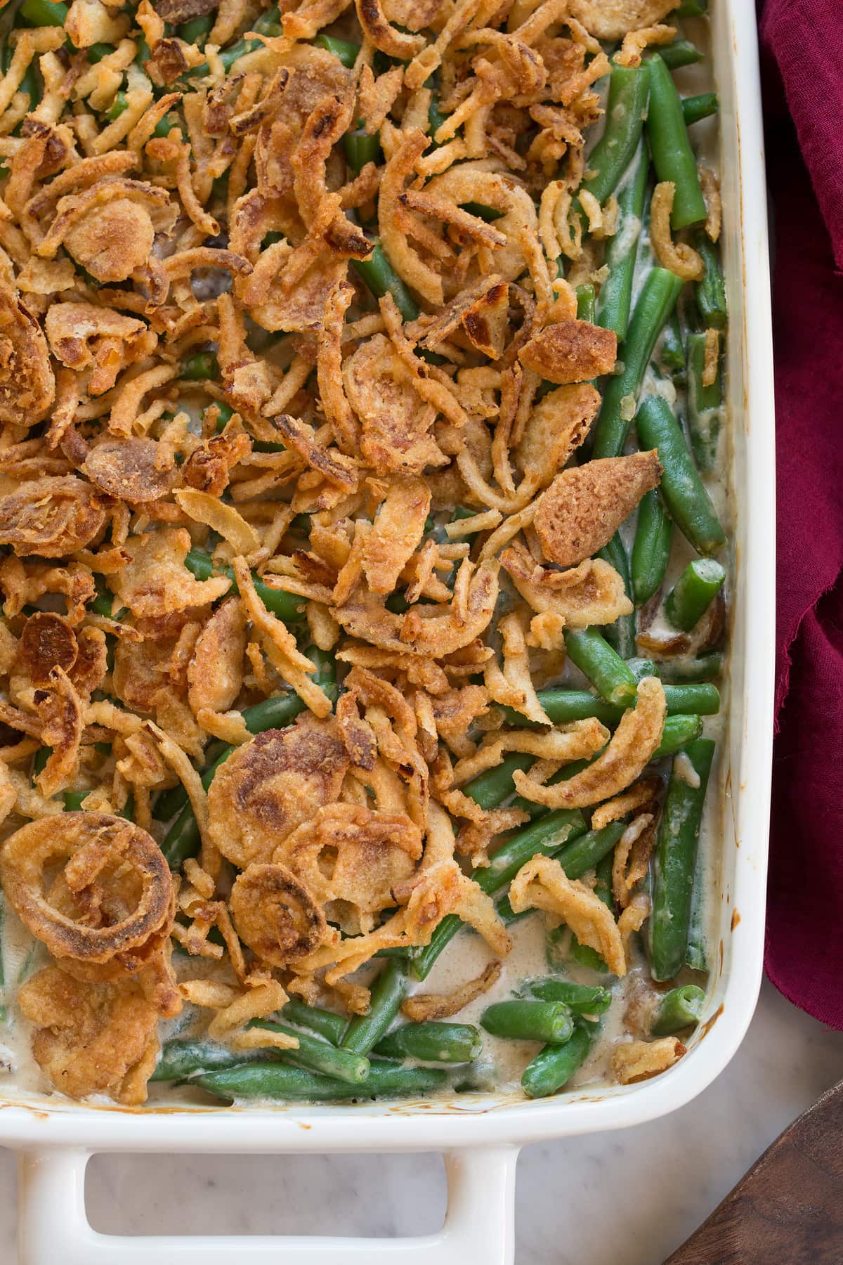 Green Bean Casserole Close up overhead image of green bean casserole showing texture of topping and filling.