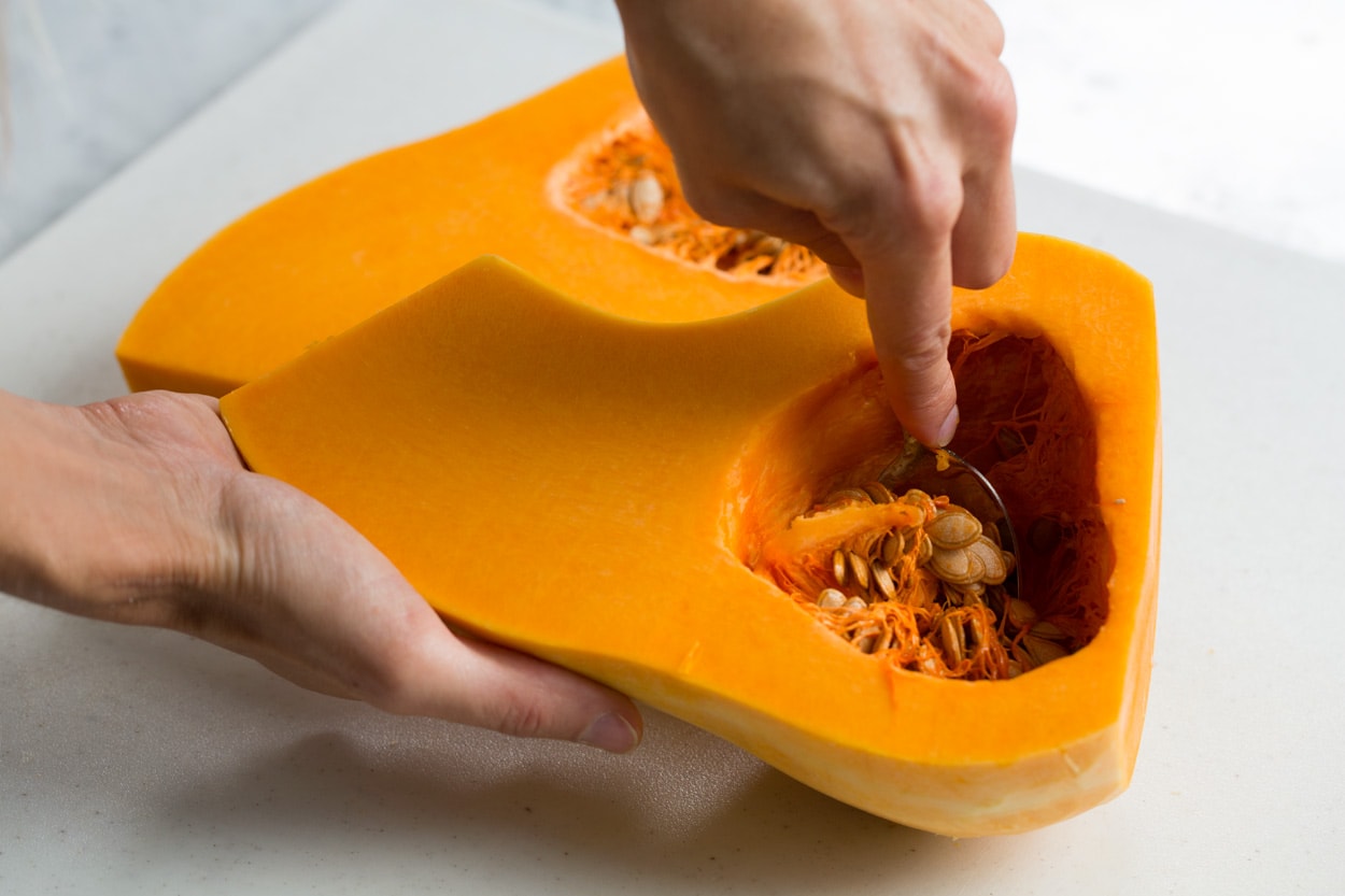 Roasted Butternut Squash with Garlic and Herbs Showing how to seed a butternut squash.