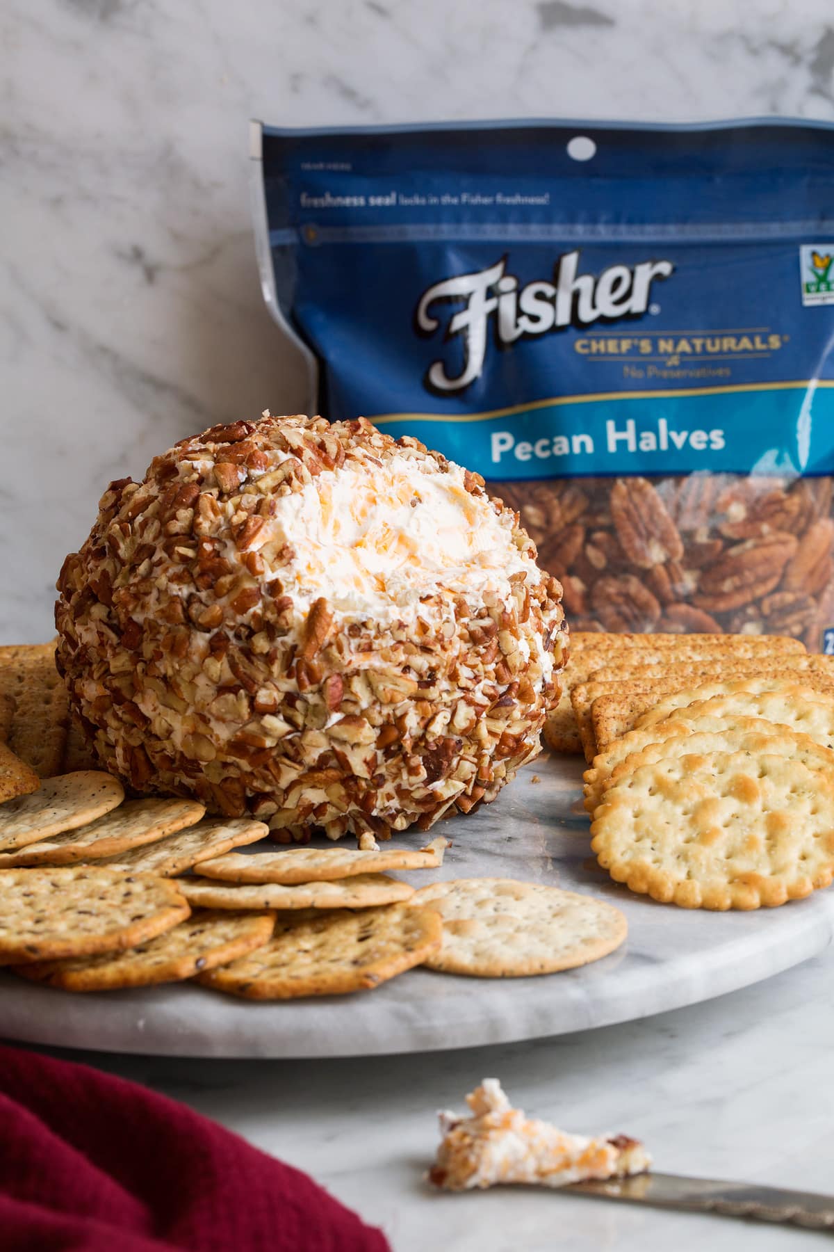 Cheese Ball Cheese ball on a serving plate with crackers.