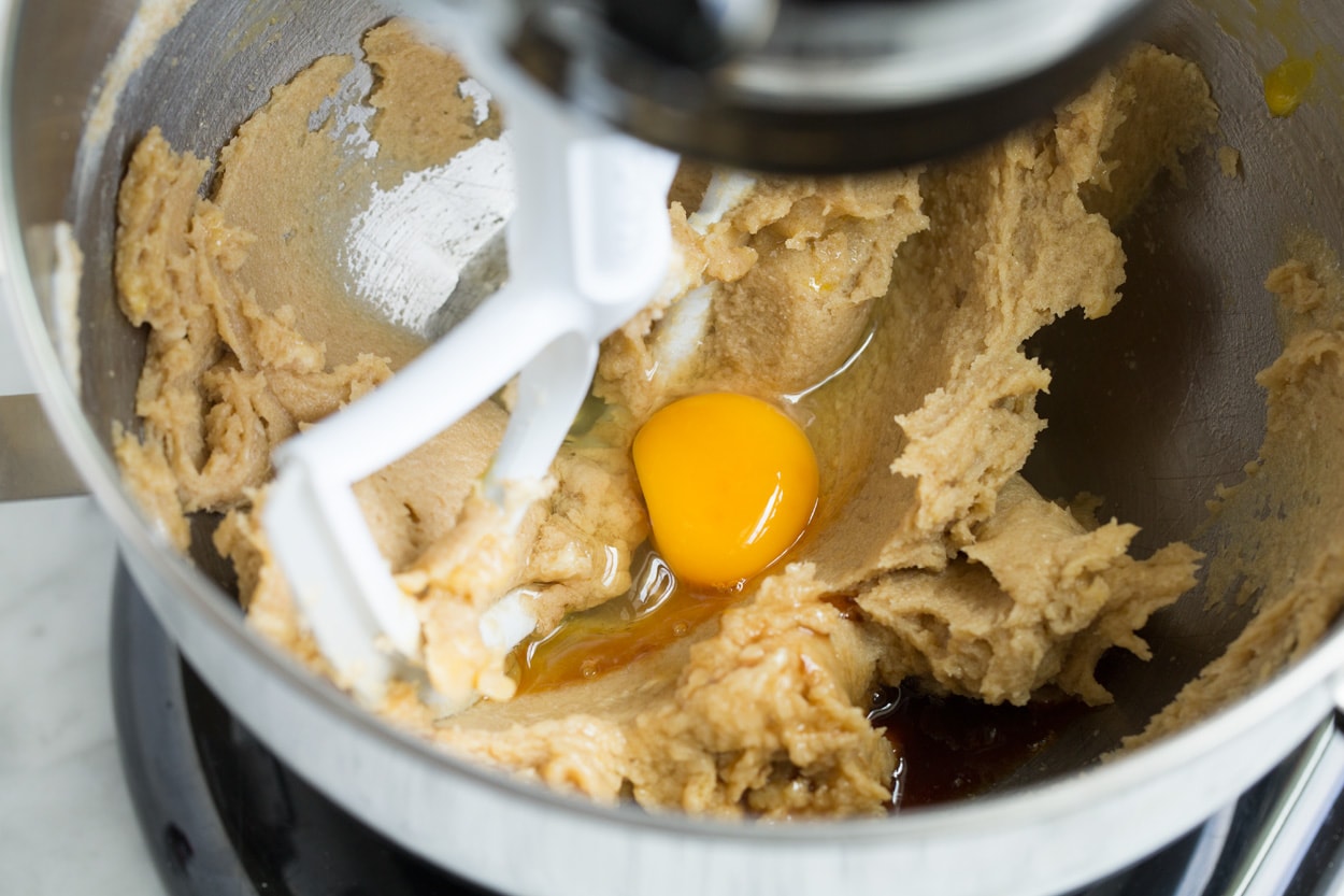 BEST Oatmeal Cookies! Adding egg and vanilla to mixture in stand mixer.