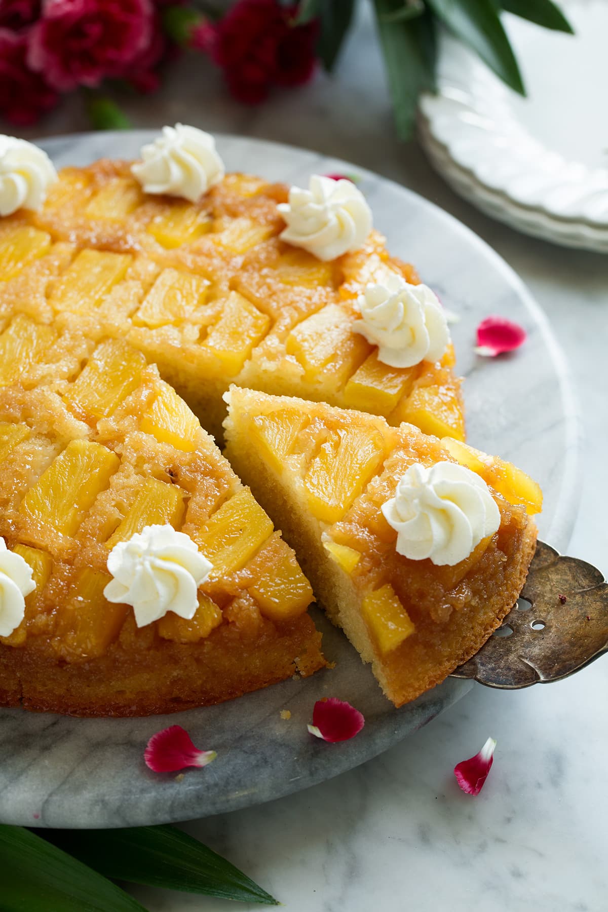 Pineapple Upside Down Cake Cutting a slice of Pineapple Upside Down Cake