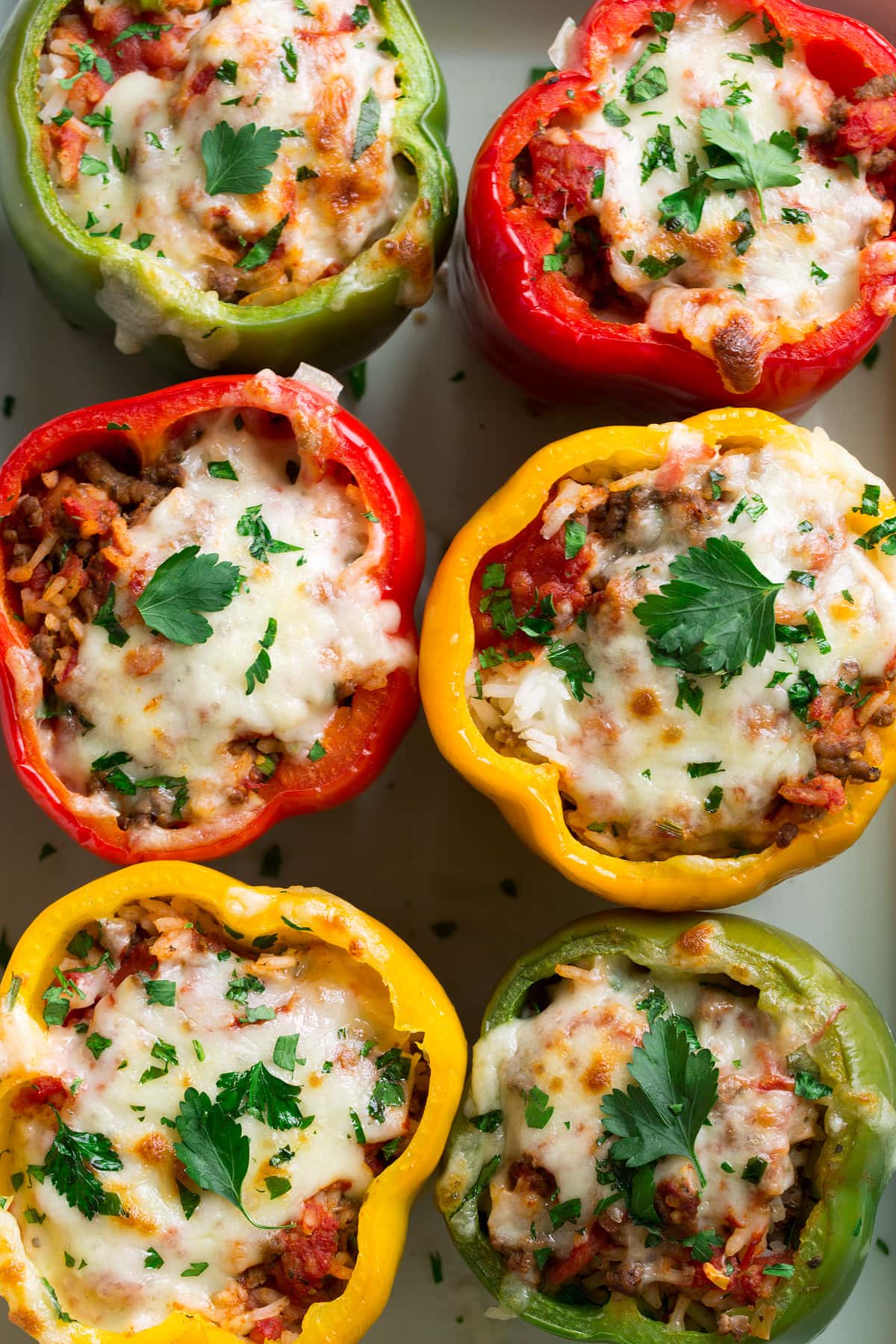 Stuffed Peppers Close up overhead image of stuffed peppers in a baking dish.