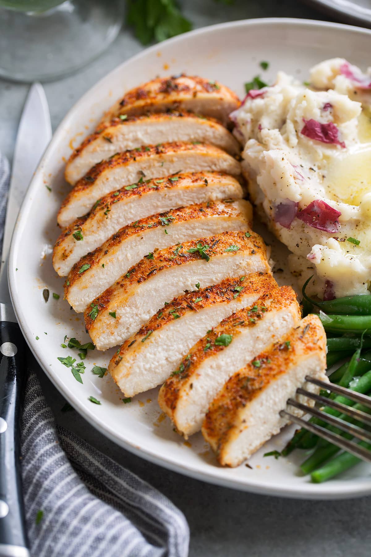 Baked Chicken Breasts Chicken breast sliced into nine pieces, showing white, tender, moist interior.