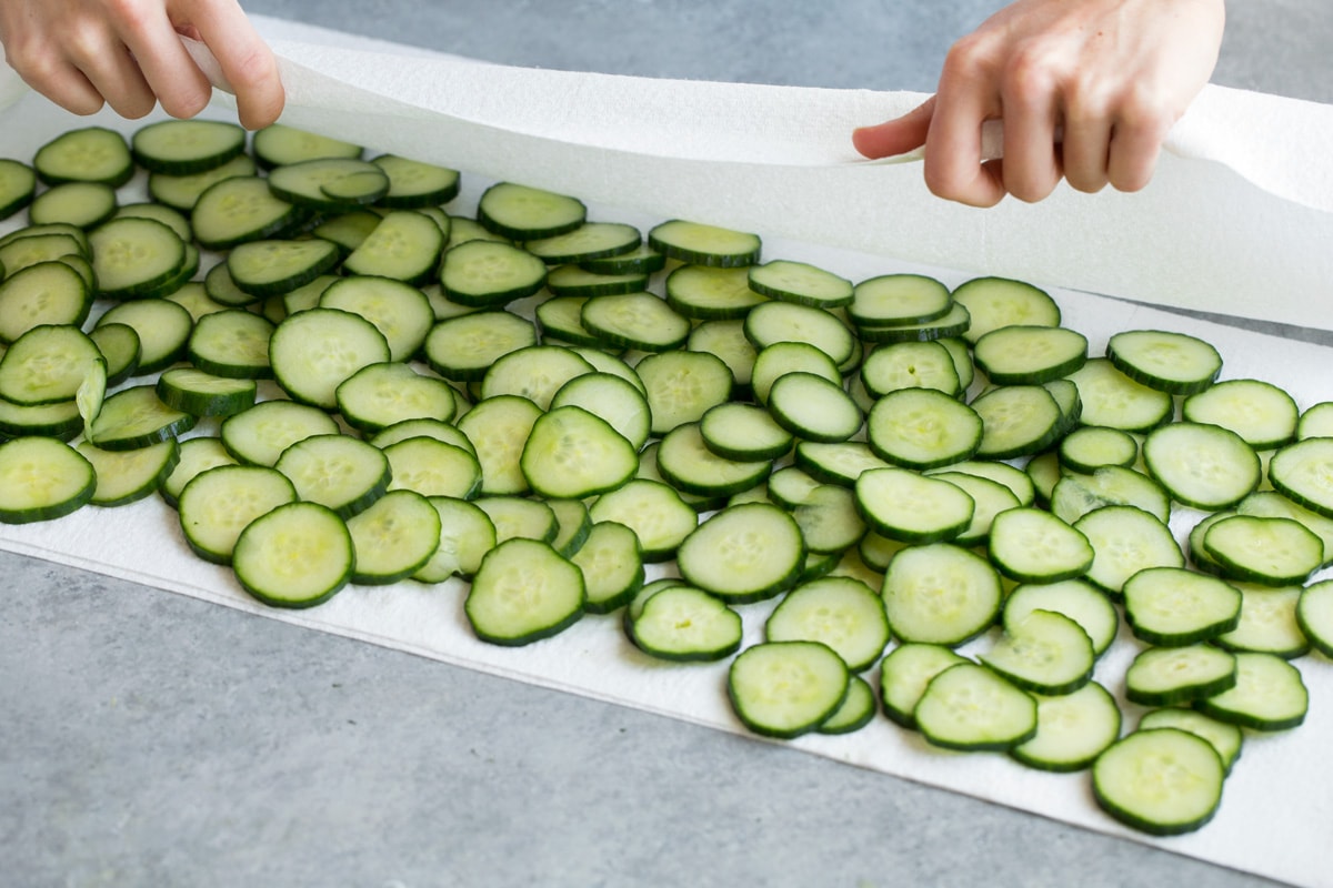 Refreshing Cucumber Salad Drying cucumbers on paper towels.