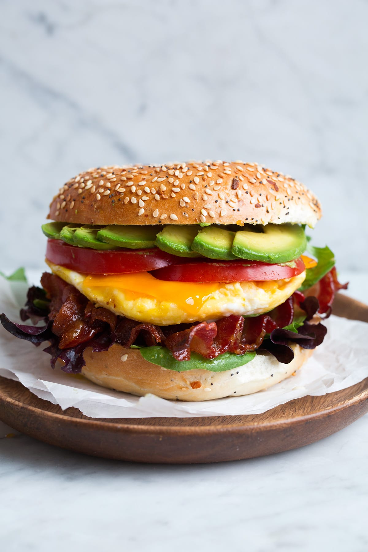 Microwave Scrambled Eggs in a Mug - super fast, super easy and always delicious! Perfect for breakfast sandwiches too! #eggs #breakfast #easybreakfast #quickbreakfast Bagel sandwich with microwave eggs, bacon, avocado, tomato, cheddar and lettuce.
