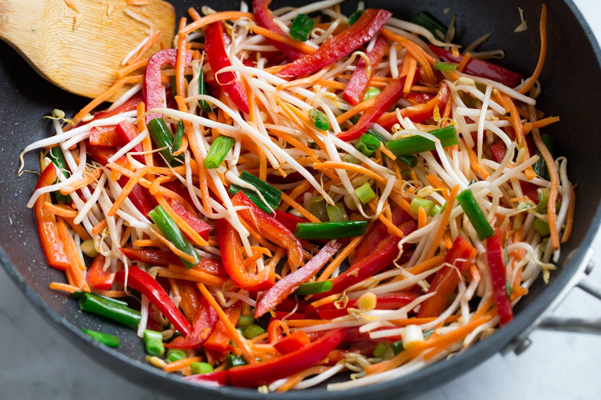 Pad Thai (with Chicken or Shrimp) Sautéing vegetables in wok for pad thai.