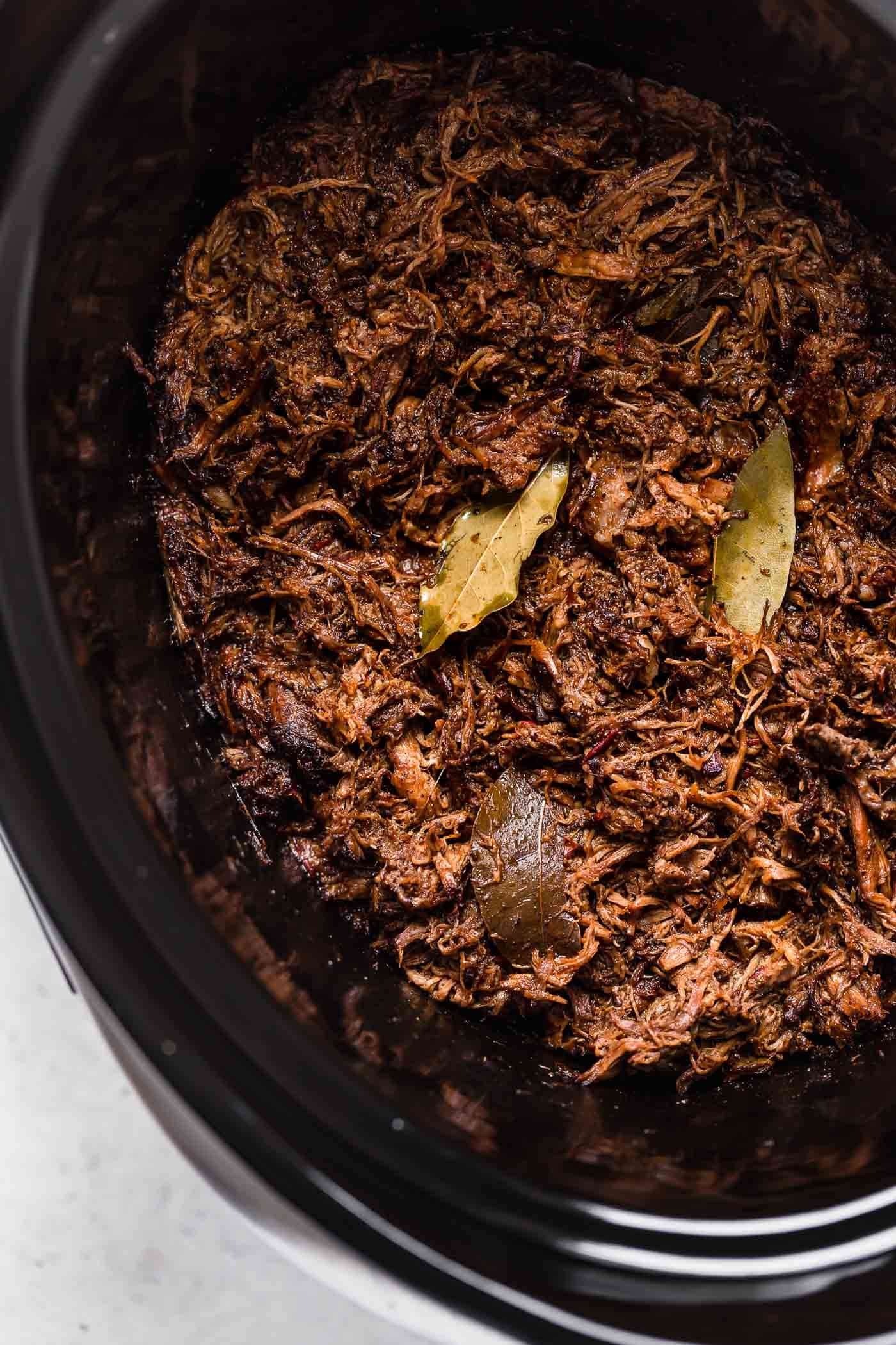 Barbacoa Beef Shredded barbacoa beef in a crock pot.
