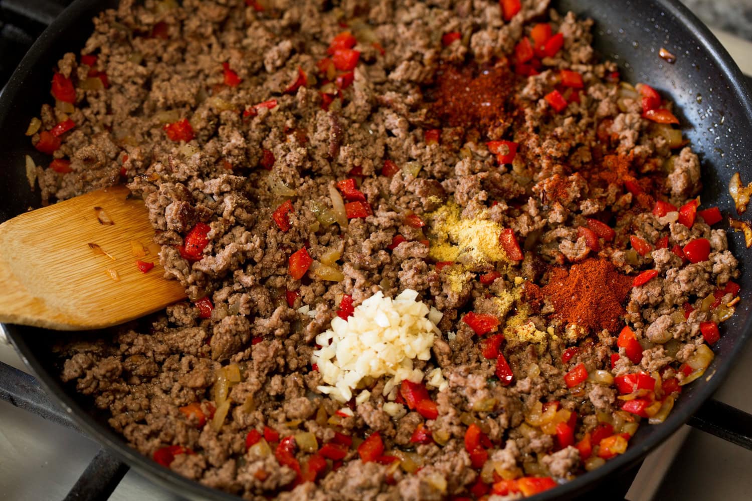 Sloppy Joes Garlic and spices added to crumbled browned beef.