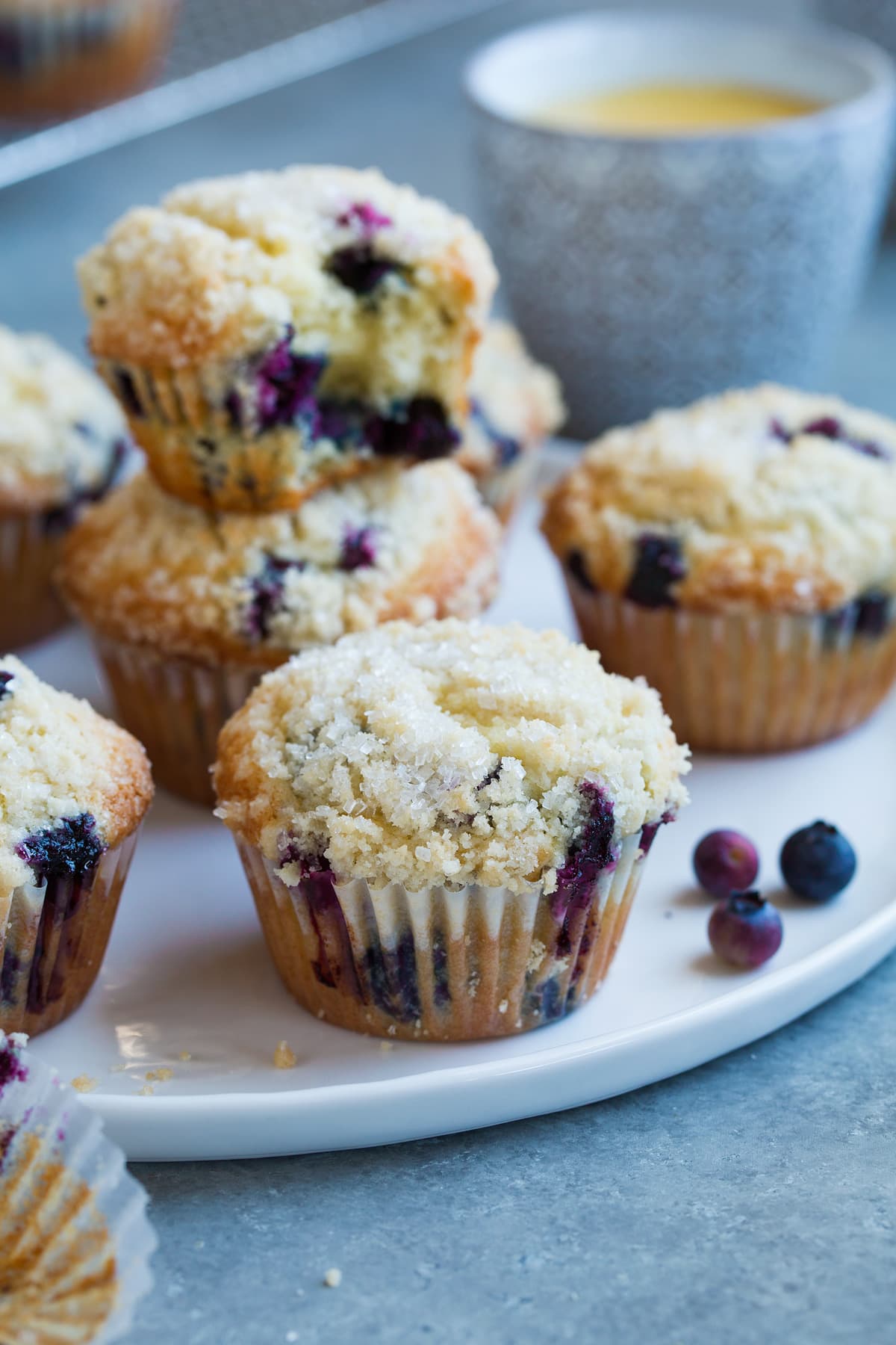 BEST EVER Blueberry Muffins! Blueberry muffins showing crumb topping.