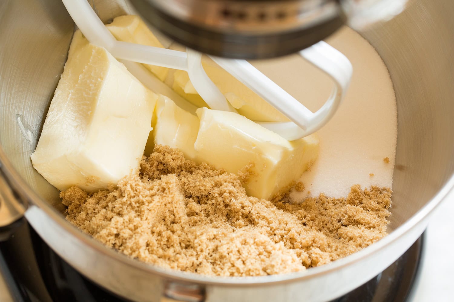 Peanut Butter Bars Creaming butter, brown sugar and white sugar in a stand mixer.