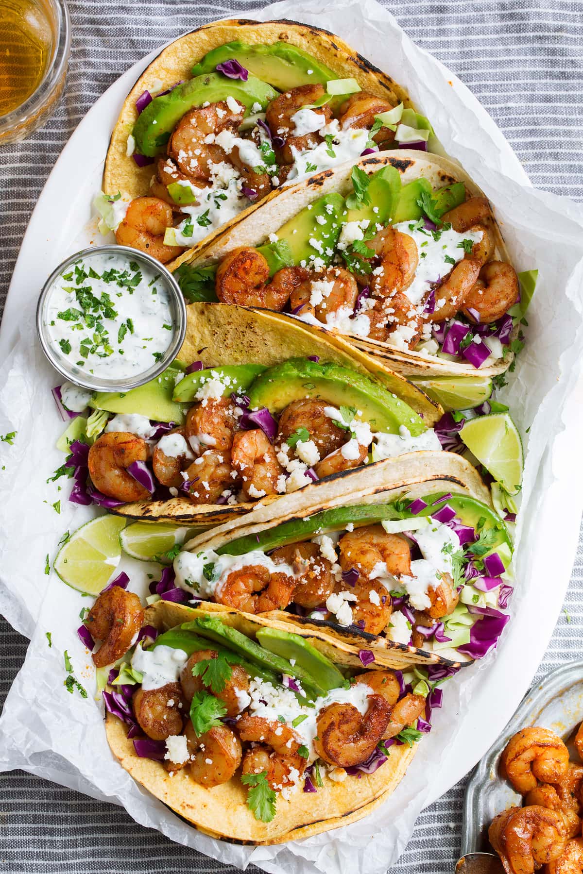 Shrimp Tacos with Cilantro Lime Crema Platter full of shrimp tacos.