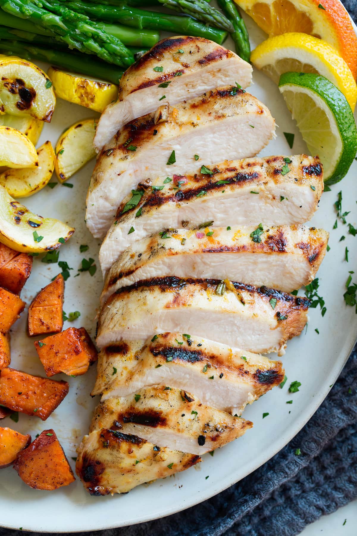 Triple Citrus Chicken Marinade - perfectly bright and refreshing! Total upgrade to plan chicken breasts or thighs. Such a delicious summer recipe! #chicken #marinade #recipe #dinner #grilled Sliced chicken breasts
